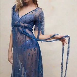 Delicate beaded and sequin appliqué on-sheer tulle fabric